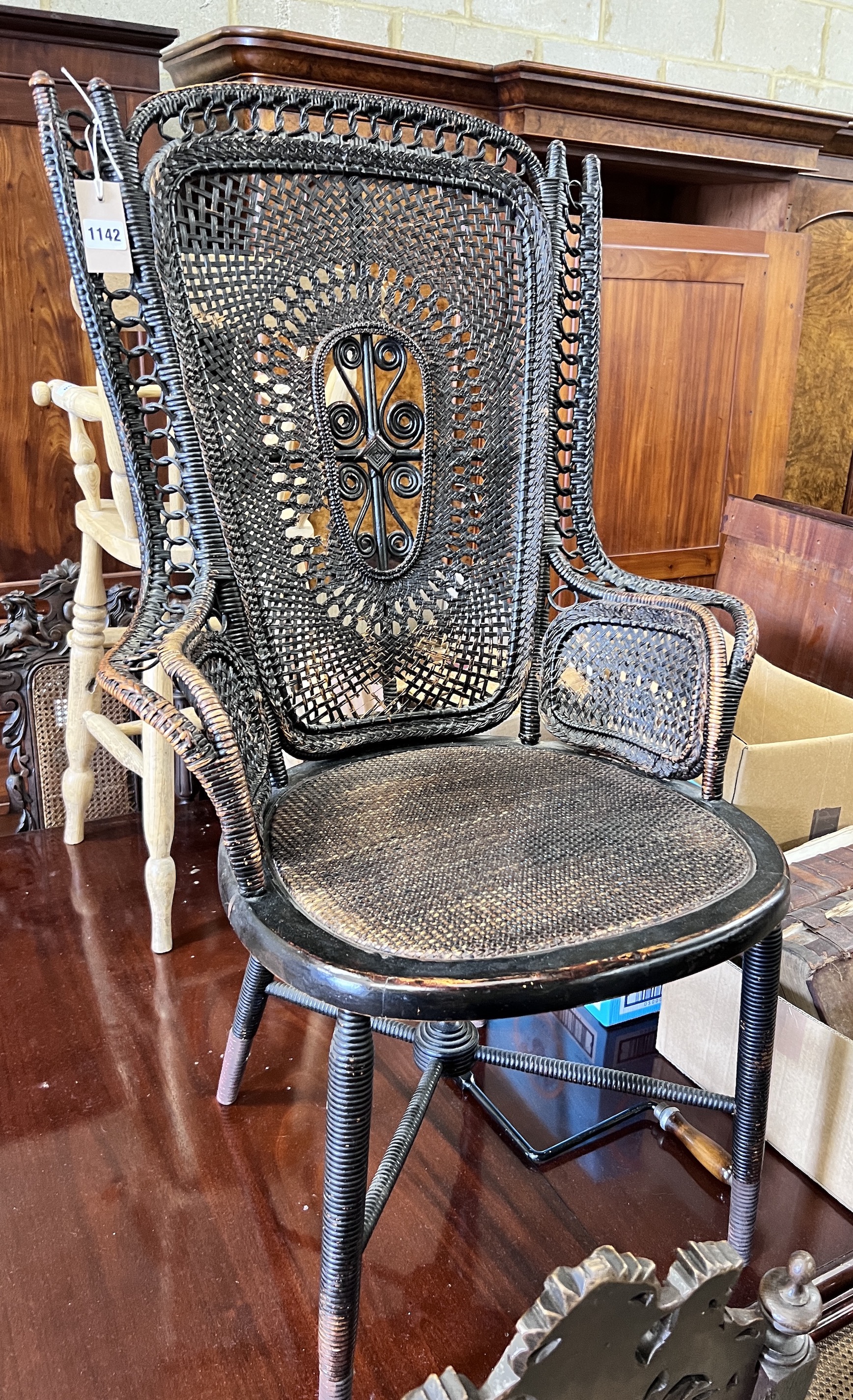 An early 20th century rattan and beech ebonised conservatory chair, height 100cm